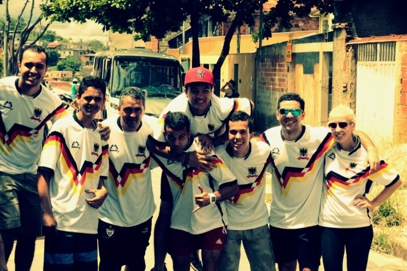 Volunteers in matching jerseys gathered on a street in Belo Horizonte