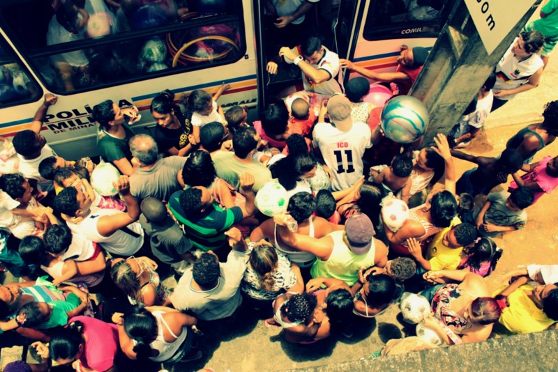 Children reaching up for toys during the Christmas delivery