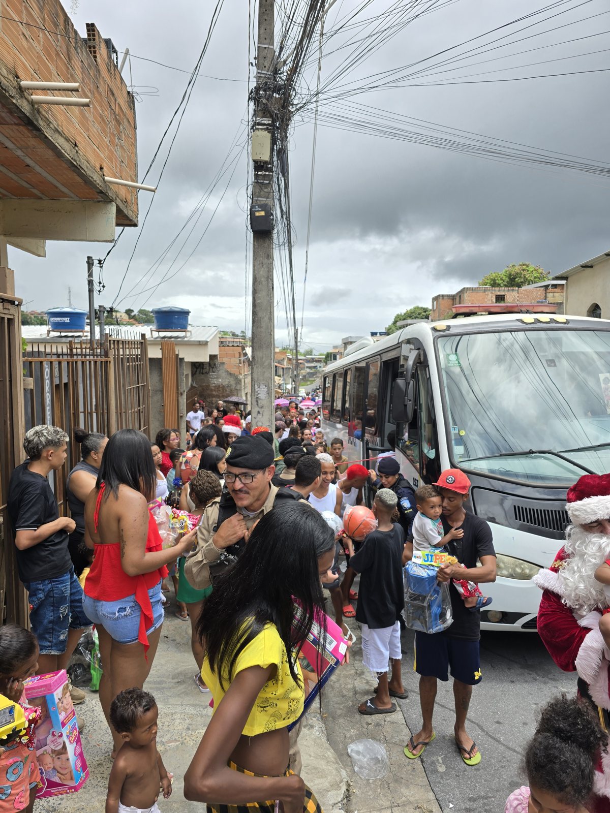 Santa greeting children from the motorcade